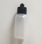 Dispensing bottles with luer lock tip caps